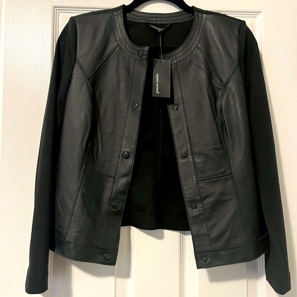 New with tag still on. Faux leather and material jacket. Black. size 4 petite.